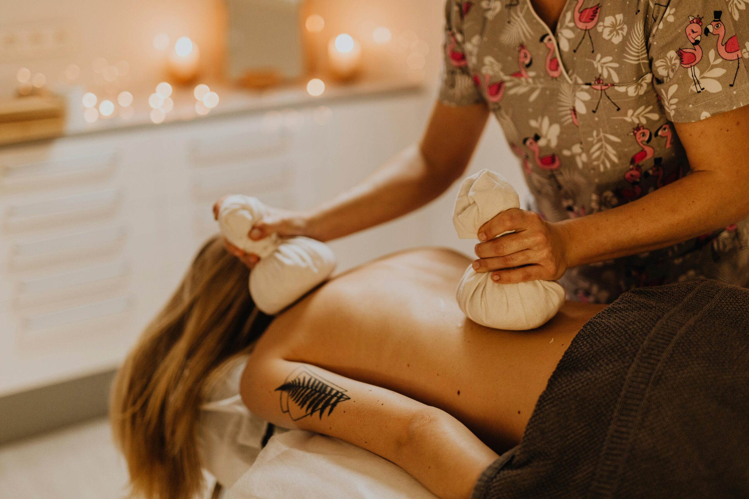 Professional hygienic massage setup with oils and towels